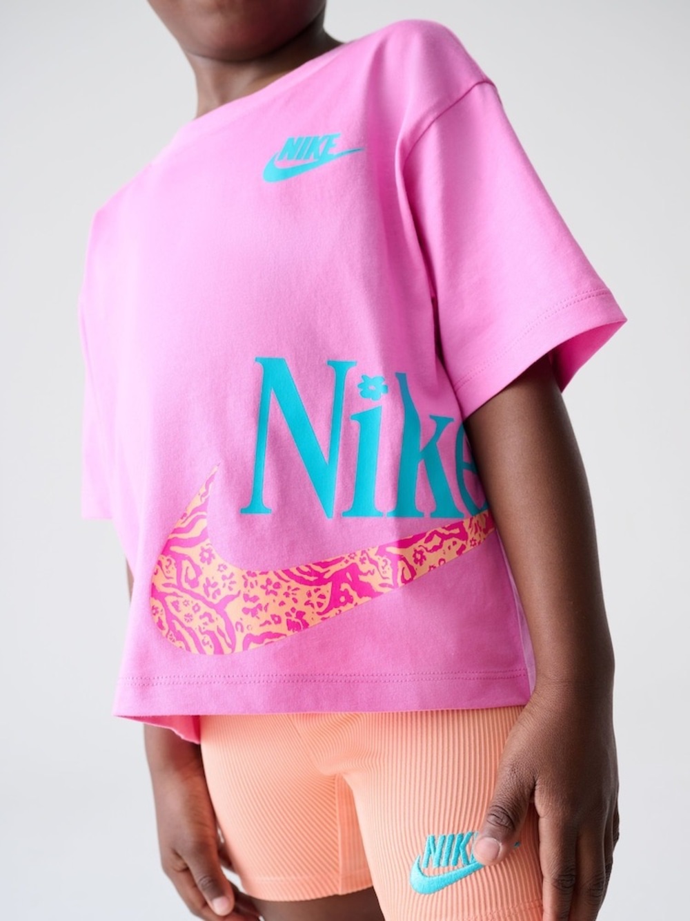 Nike boxy graphic tee and crossover waistband biker shorts set